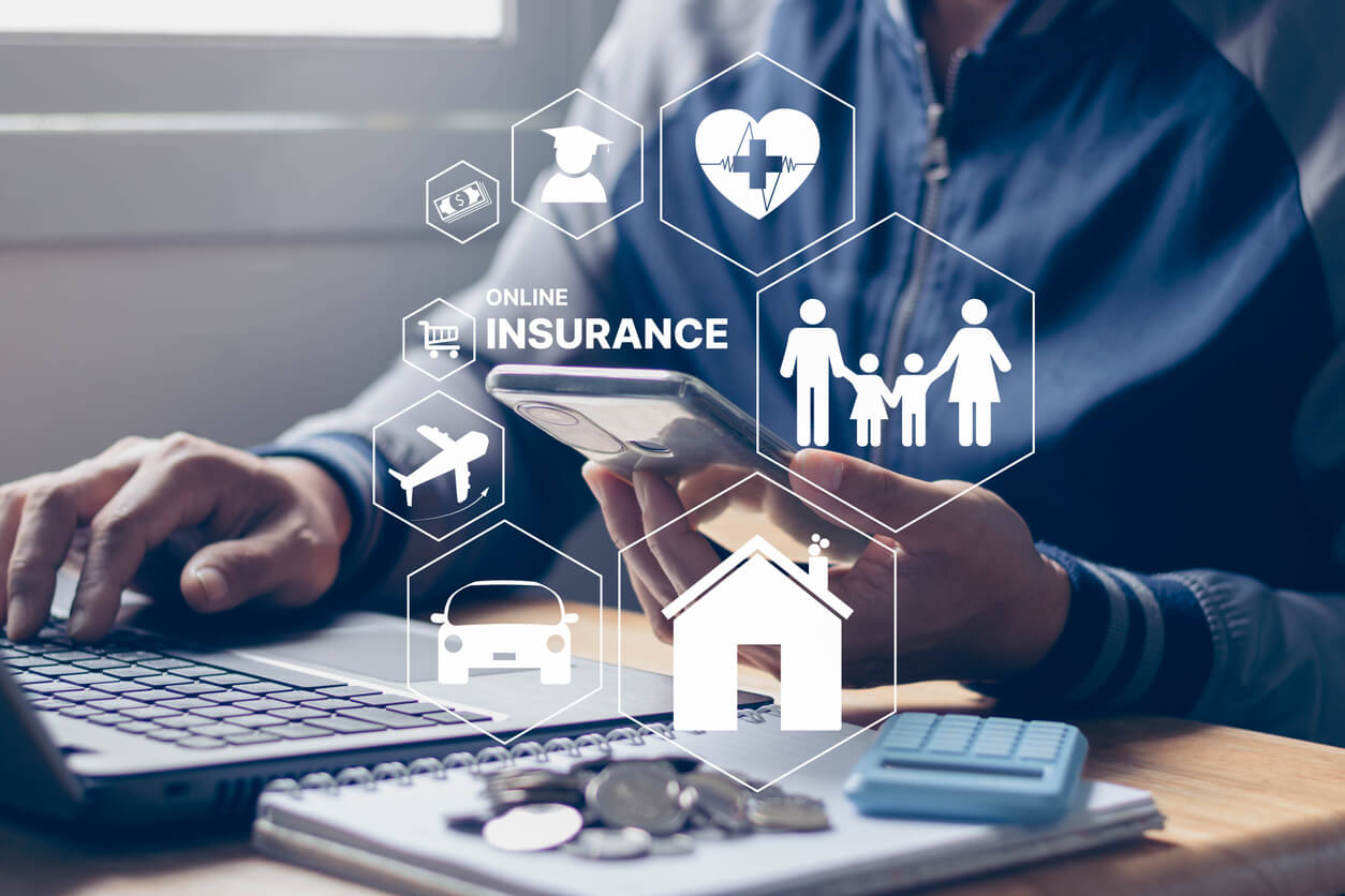 Insurance online insurtech business finance technology concept. Businessman using smartphone and computer to insurance online for life and family, property, health, car, travel, education, financial.