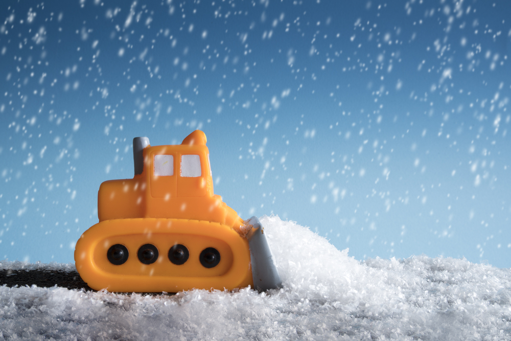 plowing snow in storm